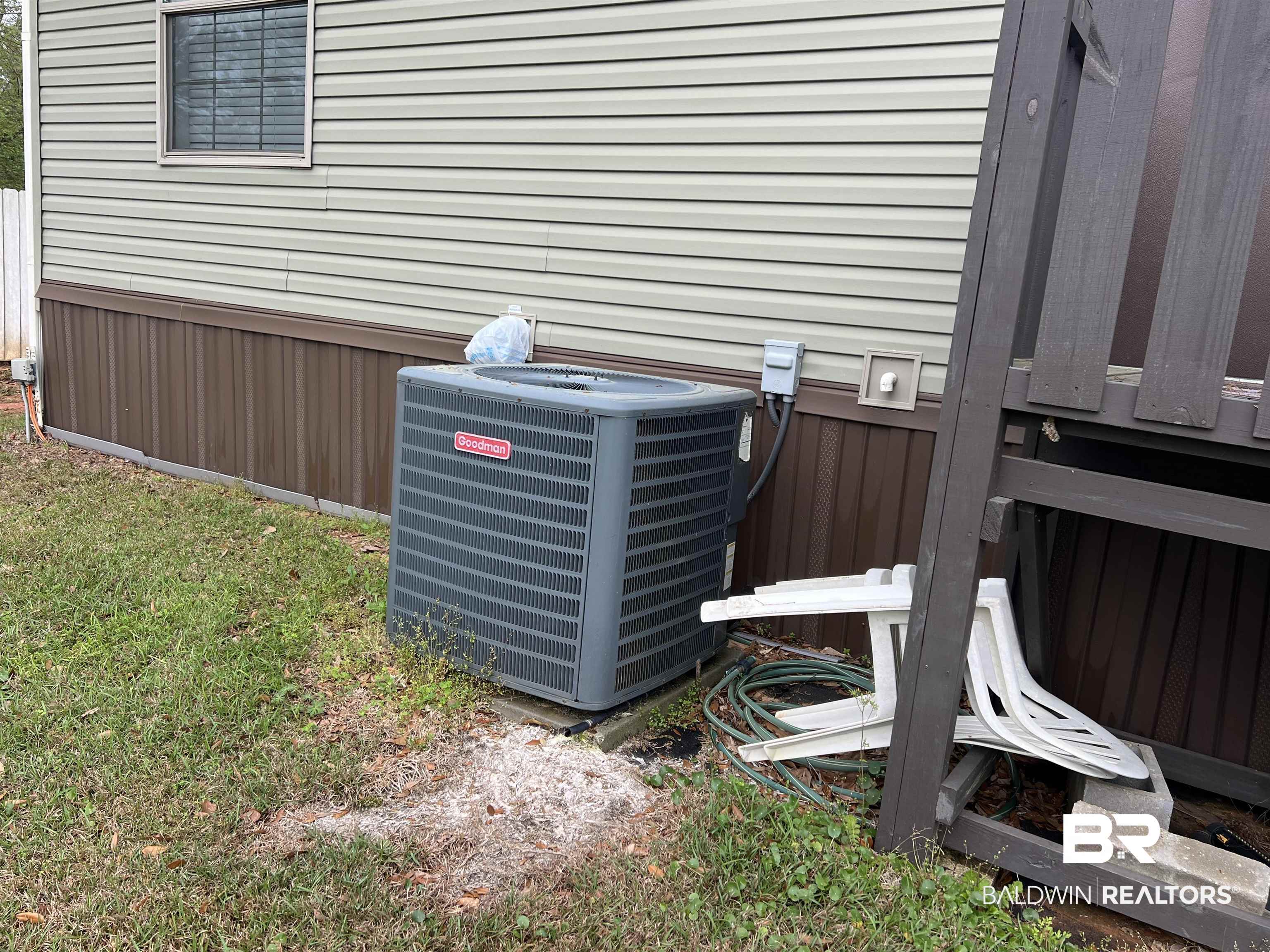 16824 Underwood Road Foley, AL 36535 - Photo 21 of 25 Details with wood walls and central AC