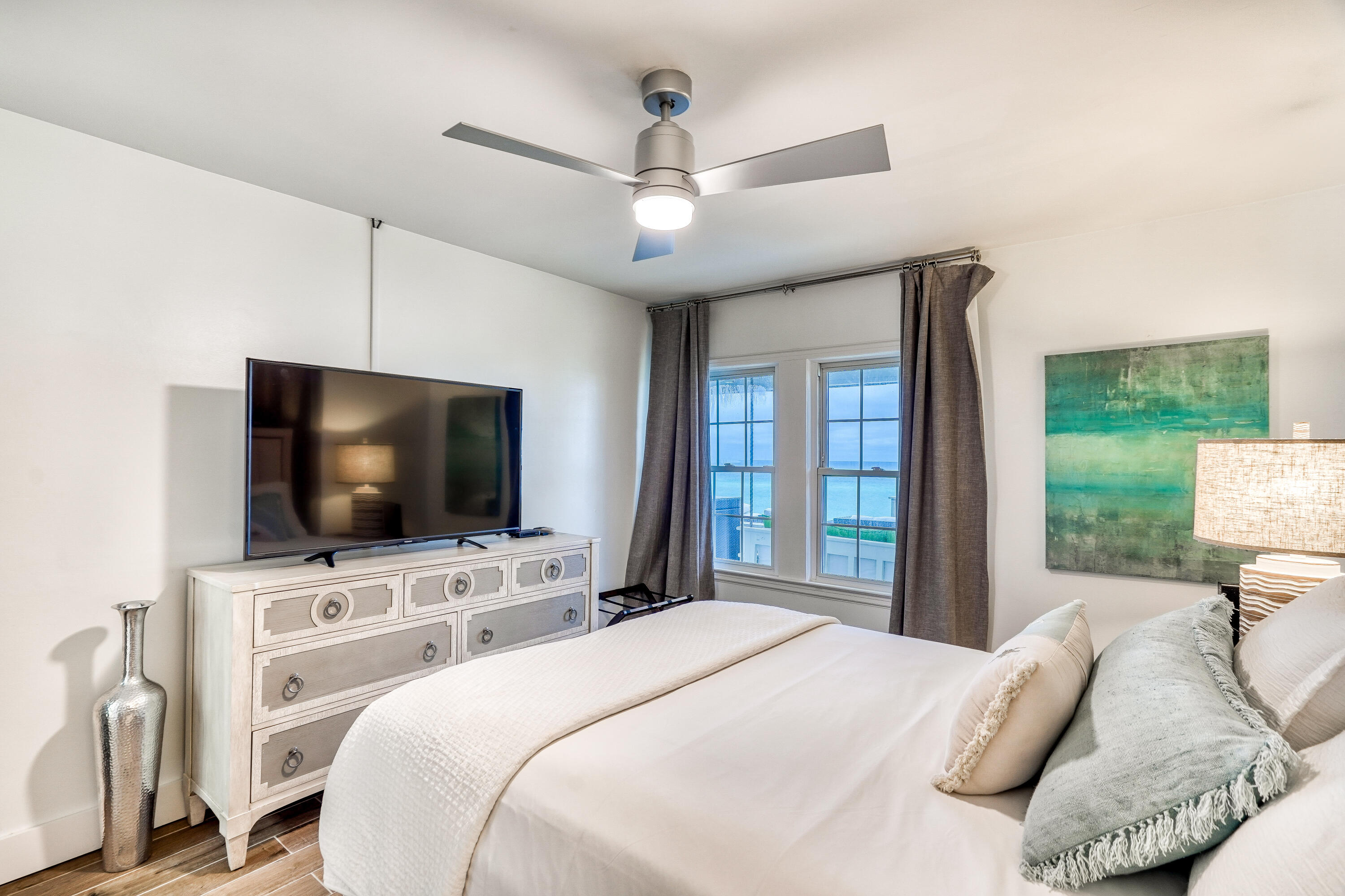 2912 East County Highway 30A Santa Rosa Beach, FL 32459 - Photo 11 of 43 a bedroom with a bed tv and a window