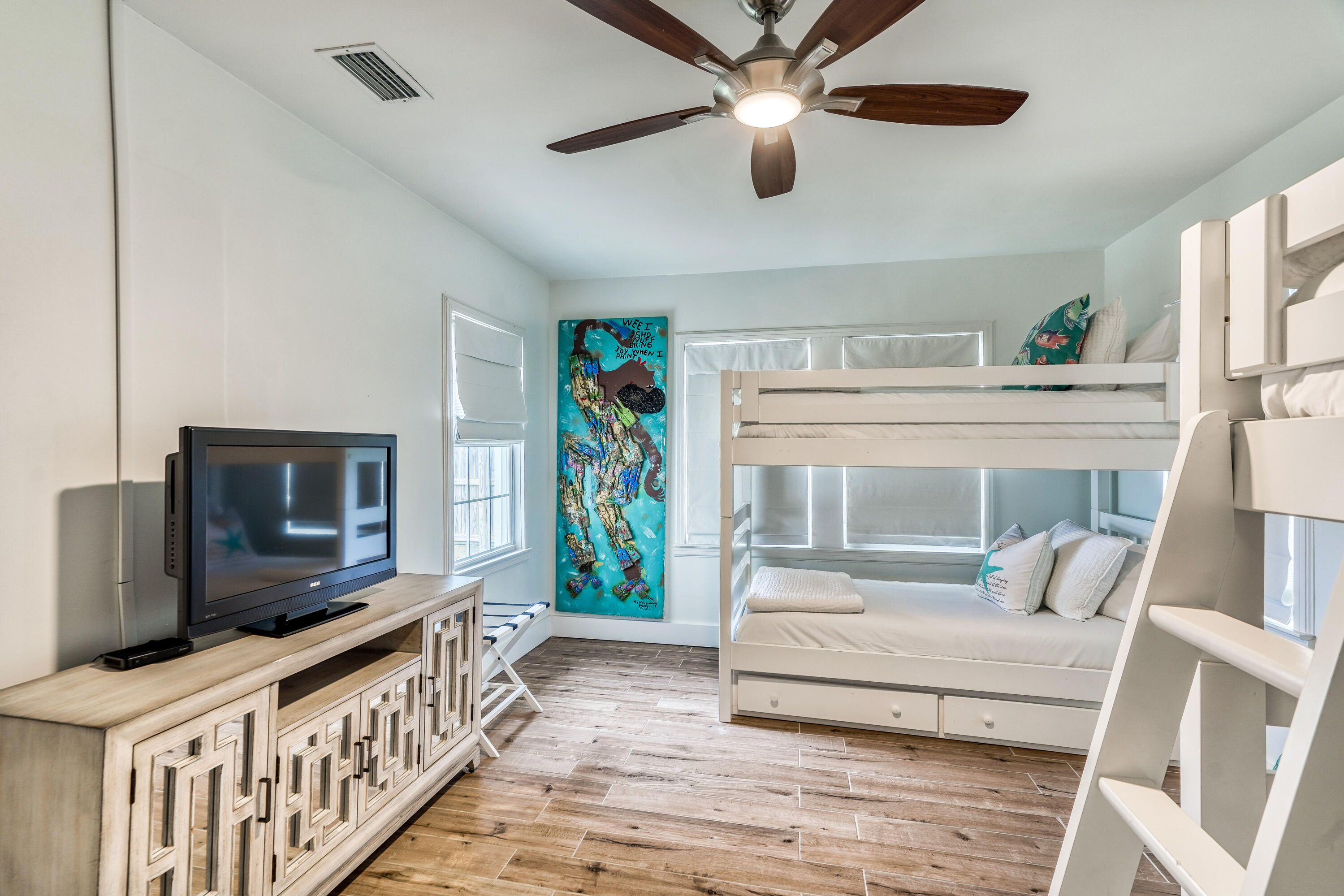 2912 East County Highway 30A Santa Rosa Beach, FL 32459 - Photo 13 of 43 a living room with furniture and a flat screen tv