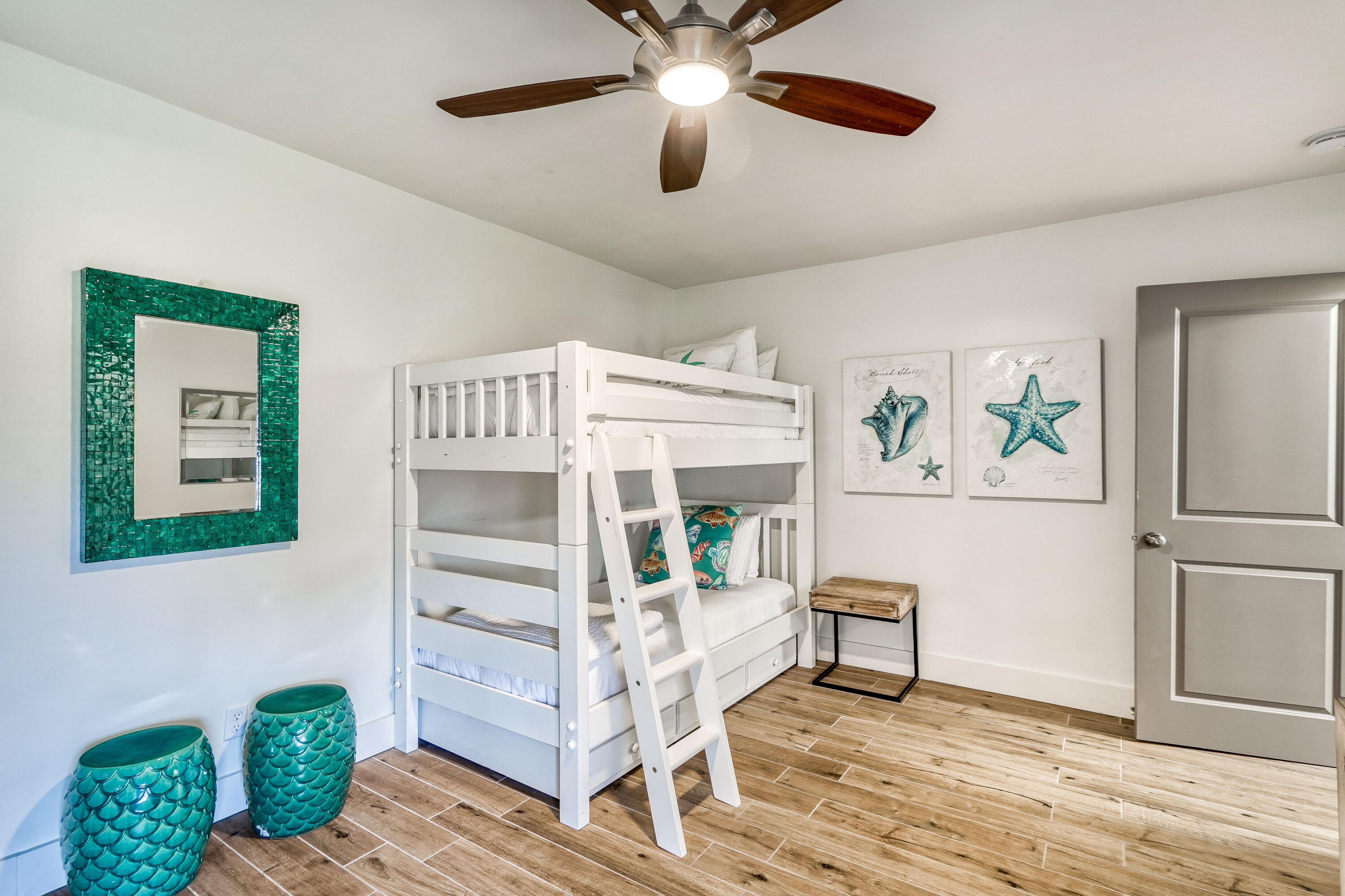 2912 East County Highway 30A Santa Rosa Beach, FL 32459 - Photo 14 of 43 a bedroom with furniture and a chandelier fan