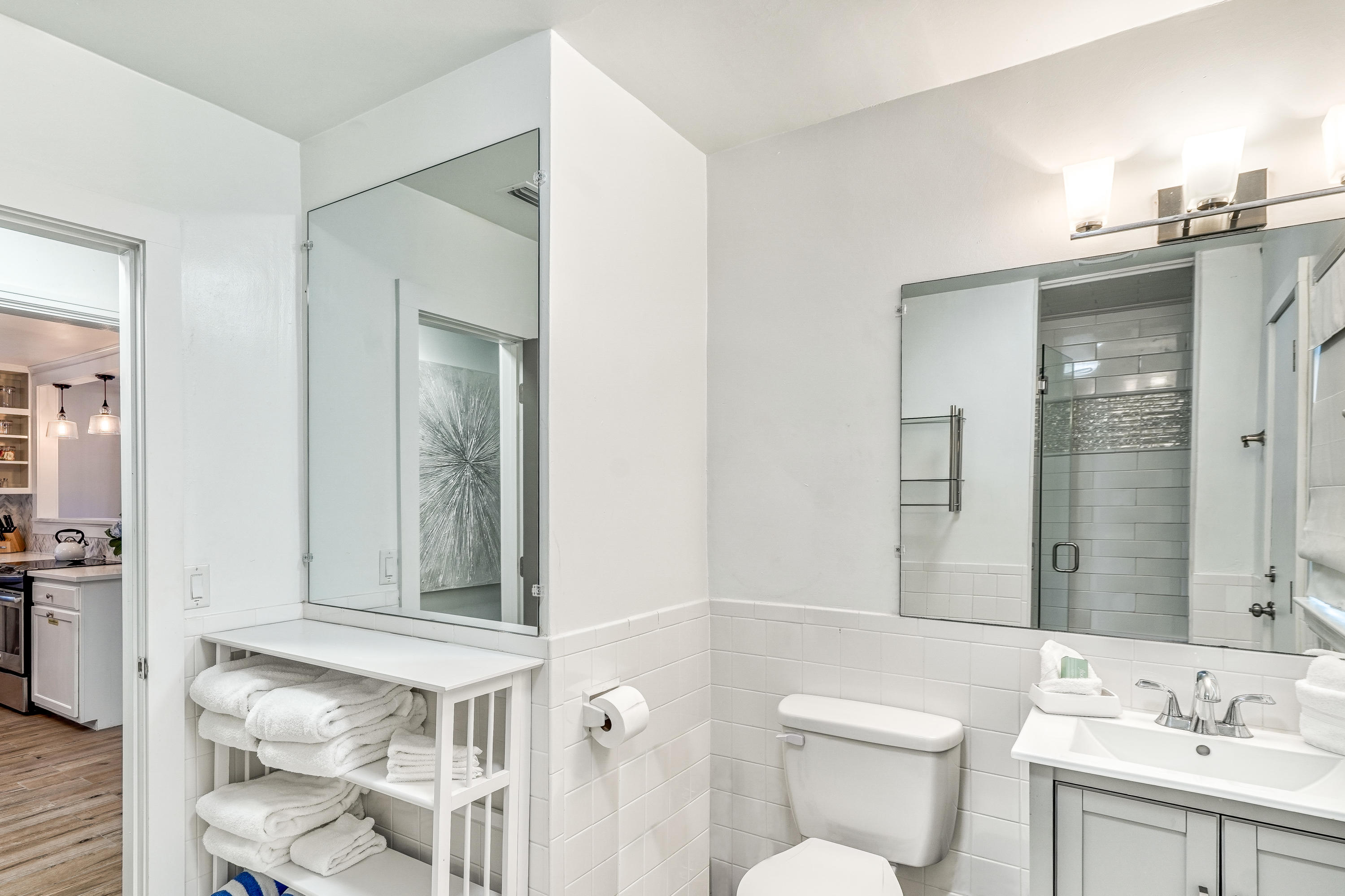 2912 East County Highway 30A Santa Rosa Beach, FL 32459 - Photo 16 of 43 a bathroom with a toilet sink and mirror