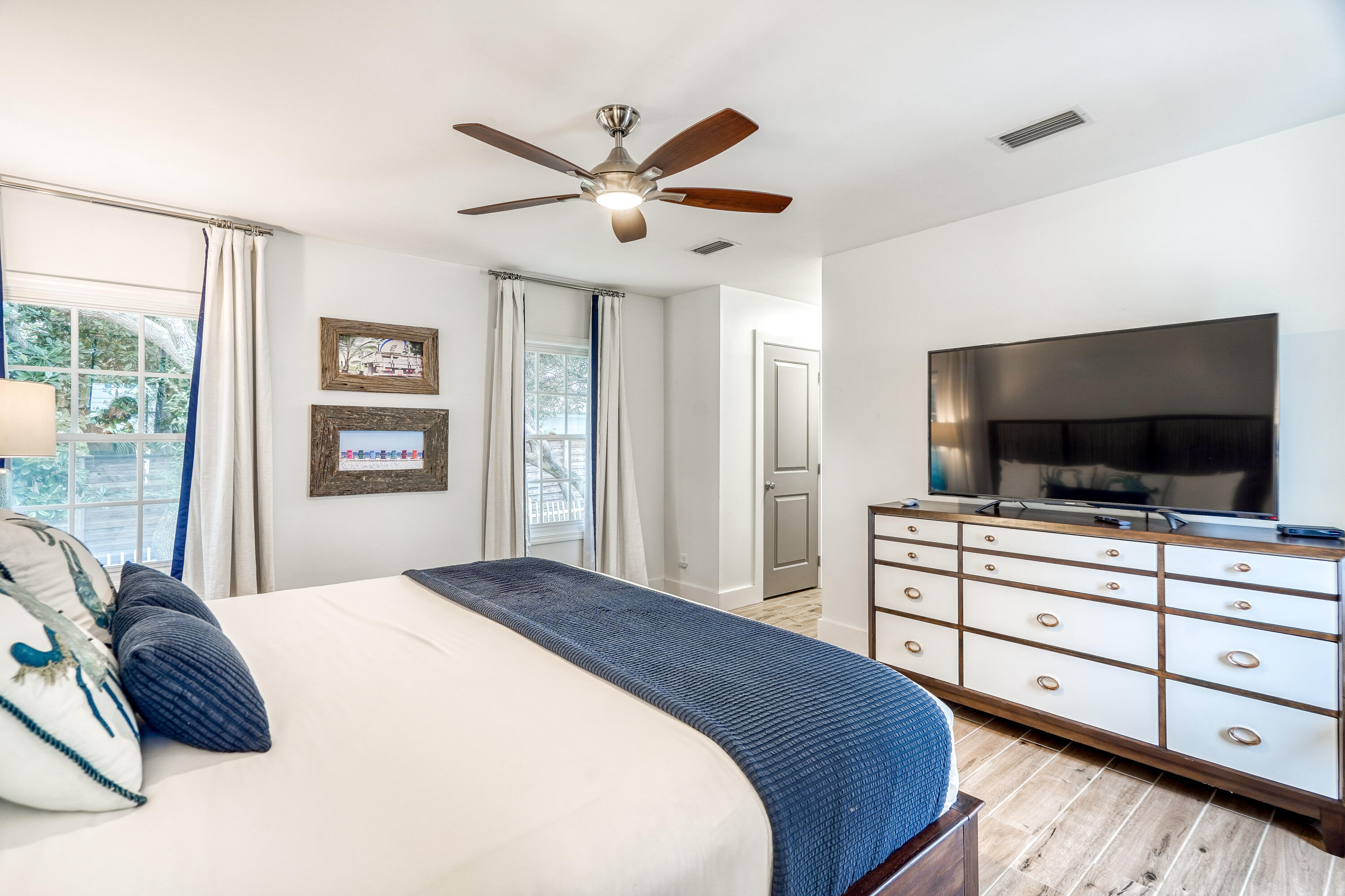 2912 East County Highway 30A Santa Rosa Beach, FL 32459 - Photo 20 of 43 a bedroom with a bed and a flat screen tv