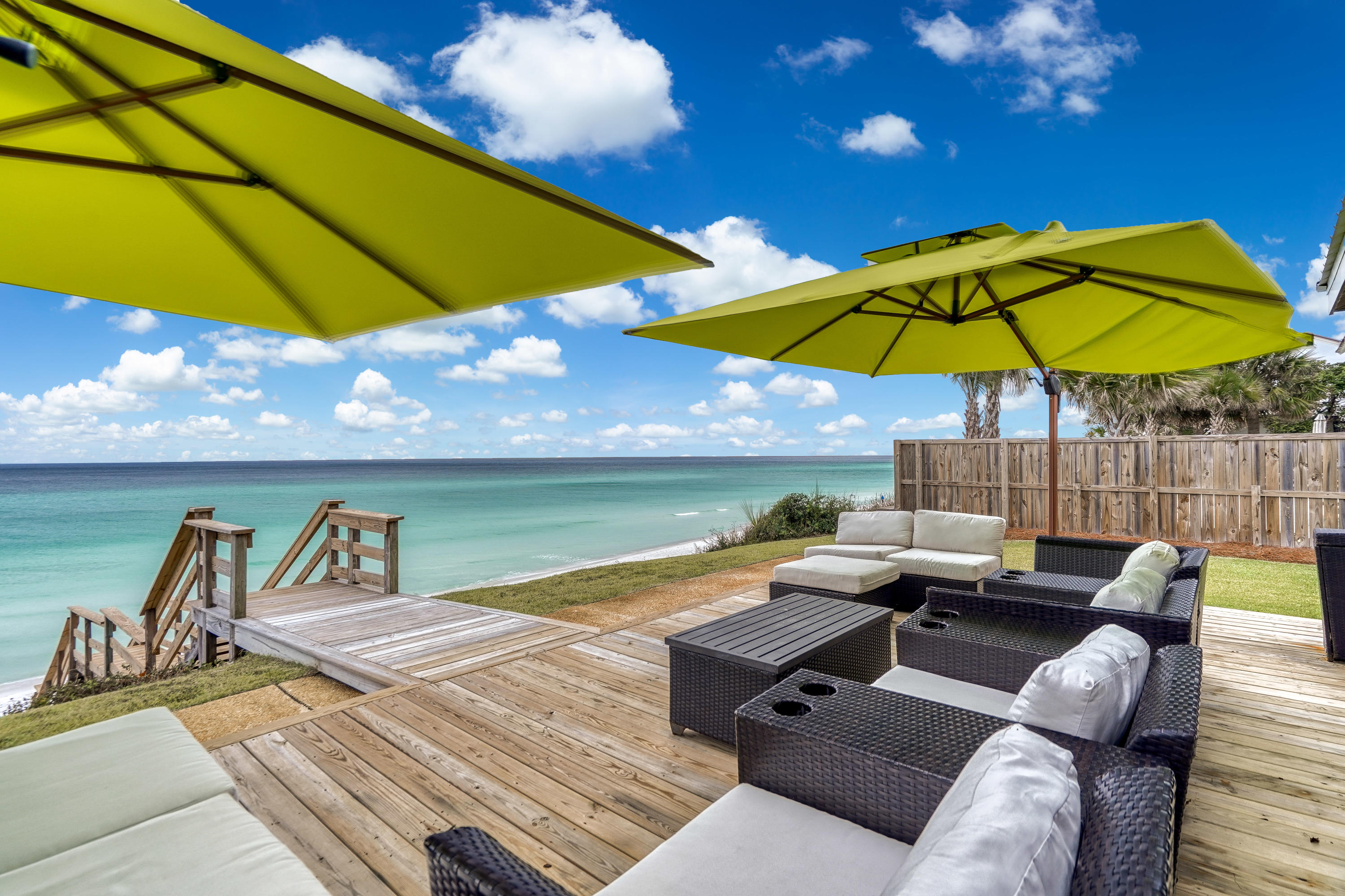2912 East County Highway 30A Santa Rosa Beach, FL 32459 - Photo 29 of 43 a view of a terrace with furniture and umbrella