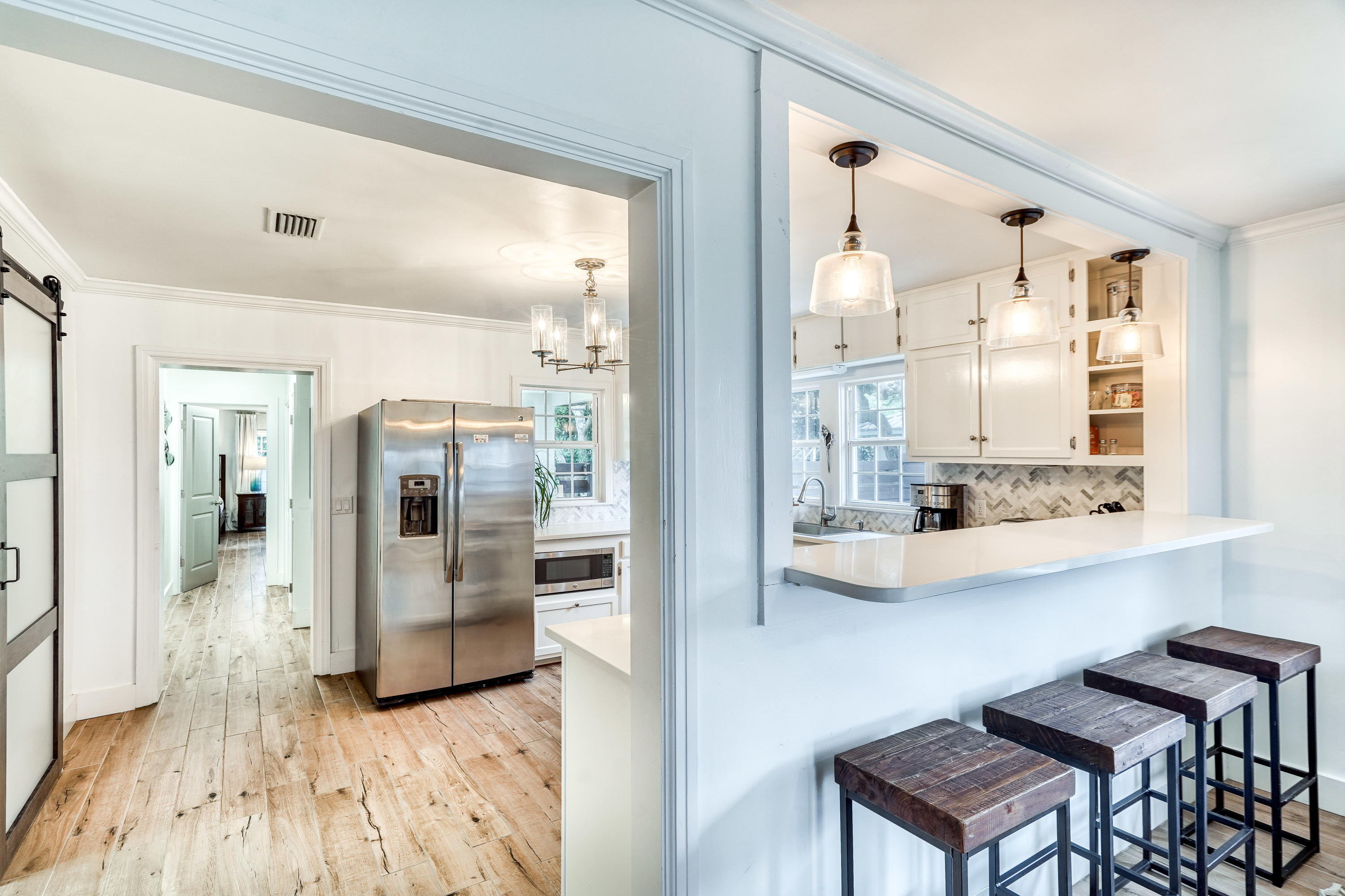 2912 East County Highway 30A Santa Rosa Beach, FL 32459 - Photo 6 of 43 a view of kitchen with furniture and wooden floor
