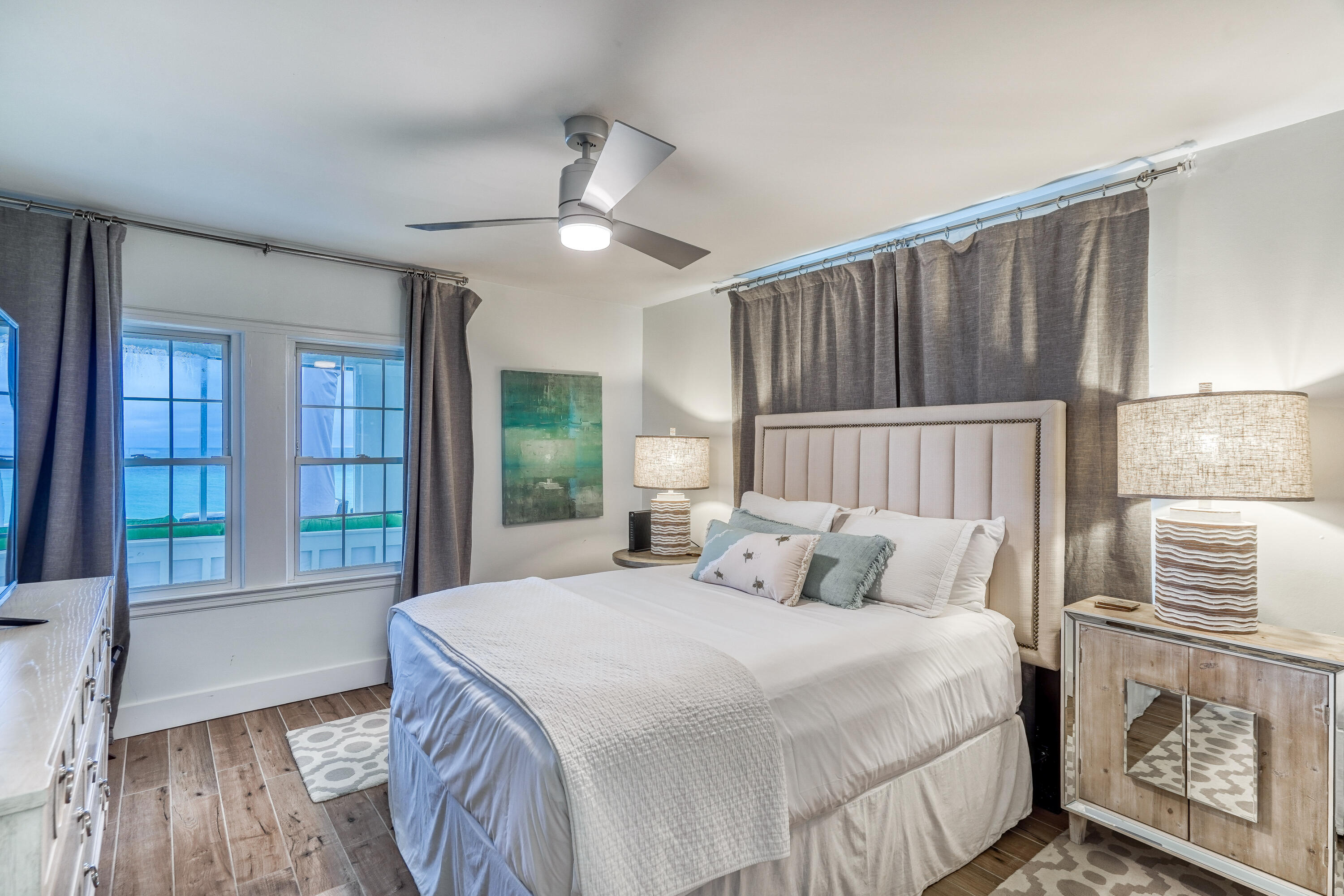 2912 East County Highway 30A Santa Rosa Beach, FL 32459 - Photo 10 of 43 a bedroom with a large bed and a window