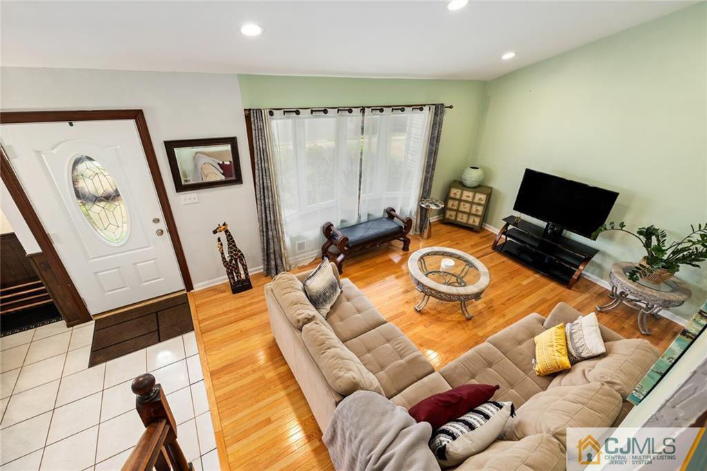 65 Albemarle Road Colonia, NJ 07067 - Photo 8 of 28 a bedroom with furniture and a flat screen tv
