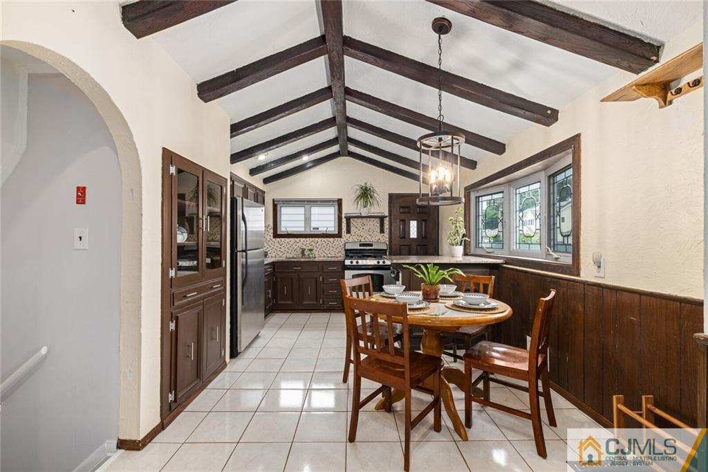 65 Albemarle Road Colonia, NJ 07067 - Photo 9 of 28 a dining room with furniture and window