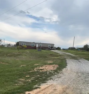 a view of a lake with houses in the back