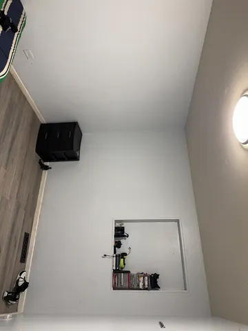 a view of workspace with wooden floor