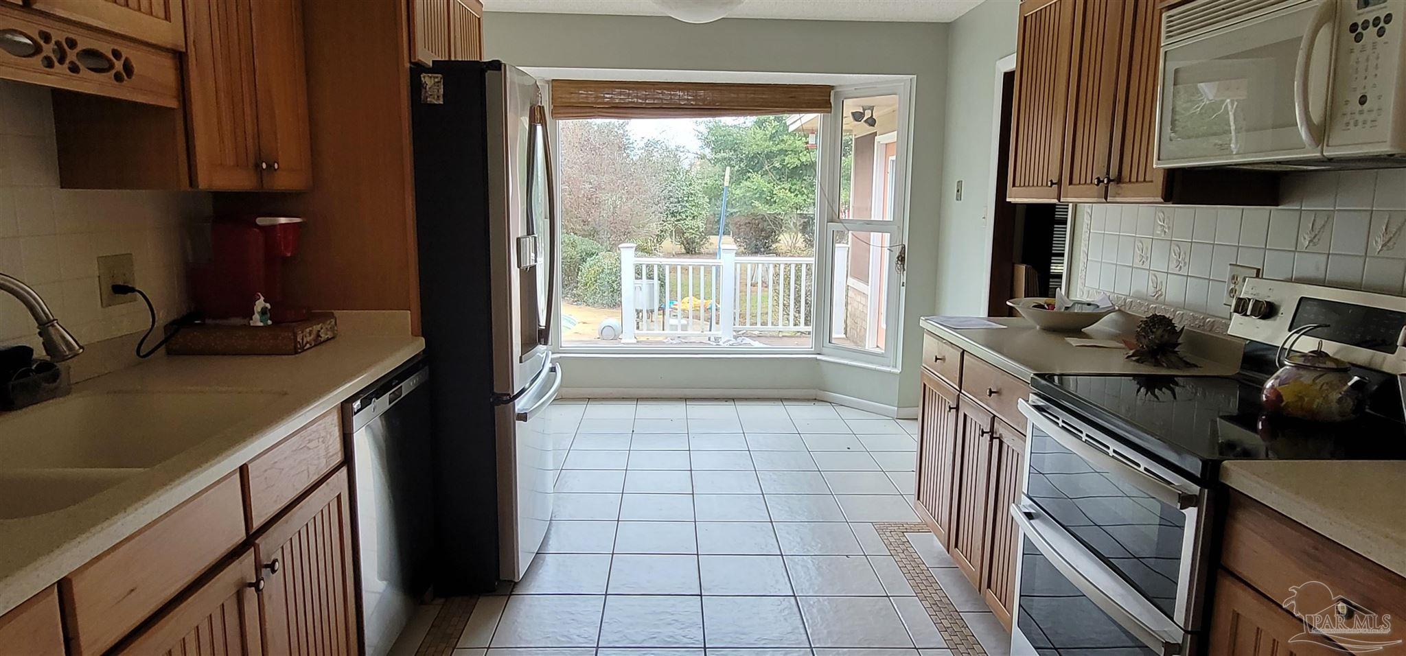 7370 Frank Reeder Road Pensacola, FL 32526 - Photo 11 of 29 Over looking the nicely landscaped pool area