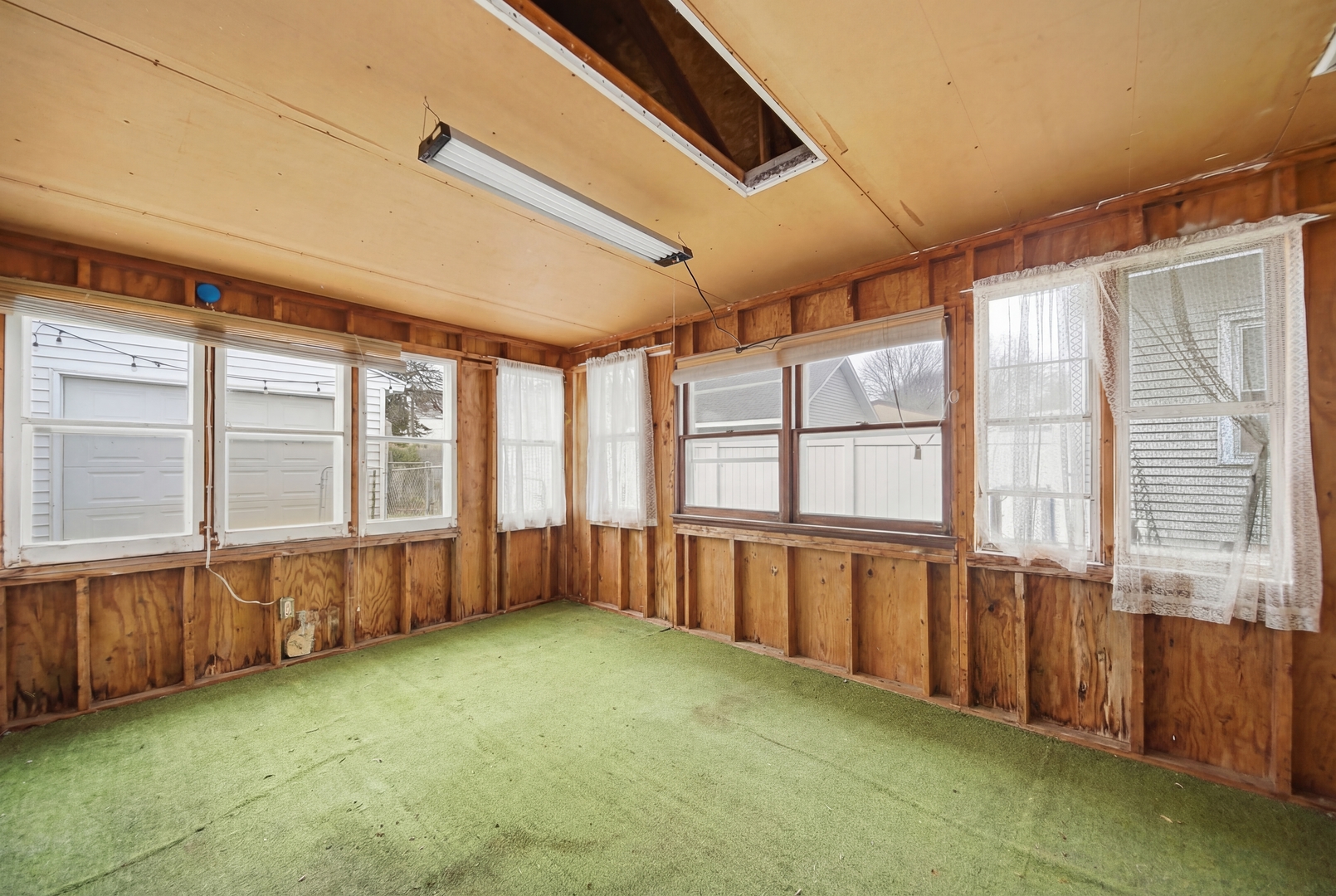 318 Spruce Street Dixon, IL 61021 - Photo 12 of 25 a large room with wooden floor and windows