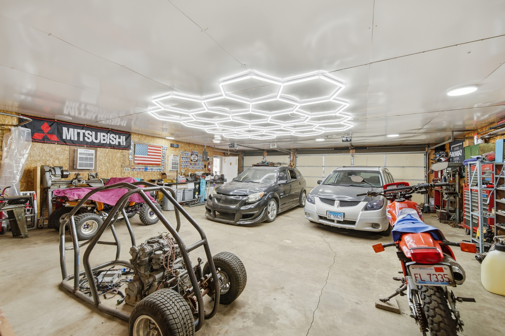 318 Spruce Street Dixon, IL 61021 - Photo 17 of 25 a view of a garage with parked cars