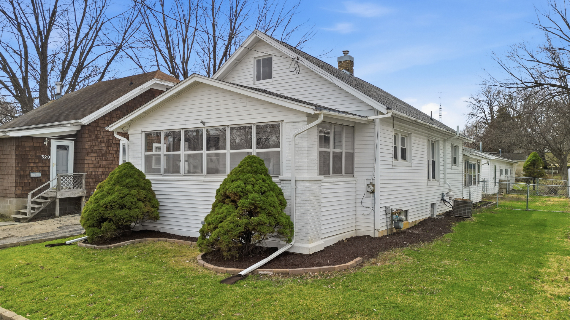 318 Spruce Street Dixon, IL 61021 - Photo 18 of 25 a view of a house with a yard