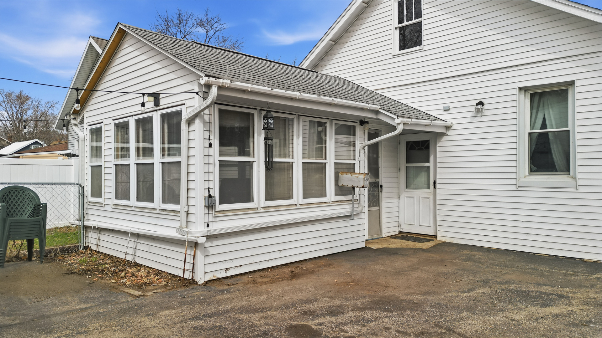 318 Spruce Street Dixon, IL 61021 - Photo 19 of 25 a view of white house with a large window