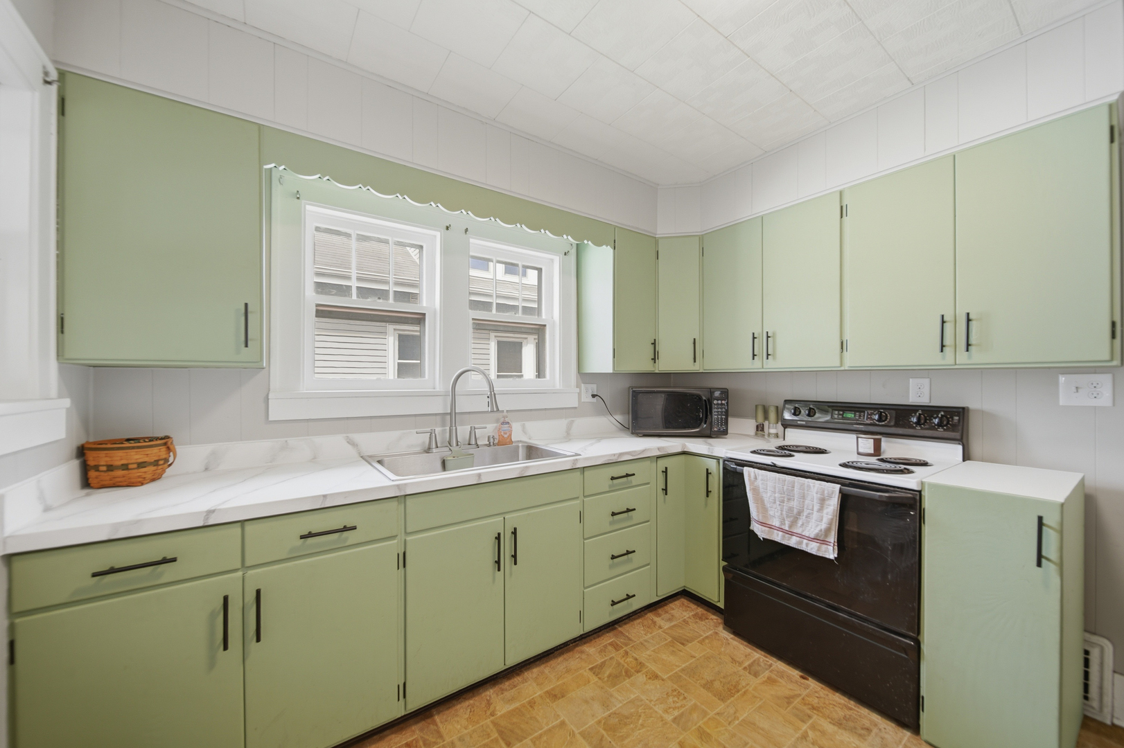318 Spruce Street Dixon, IL 61021 - Photo 7 of 25 a kitchen with a sink stove and cabinets