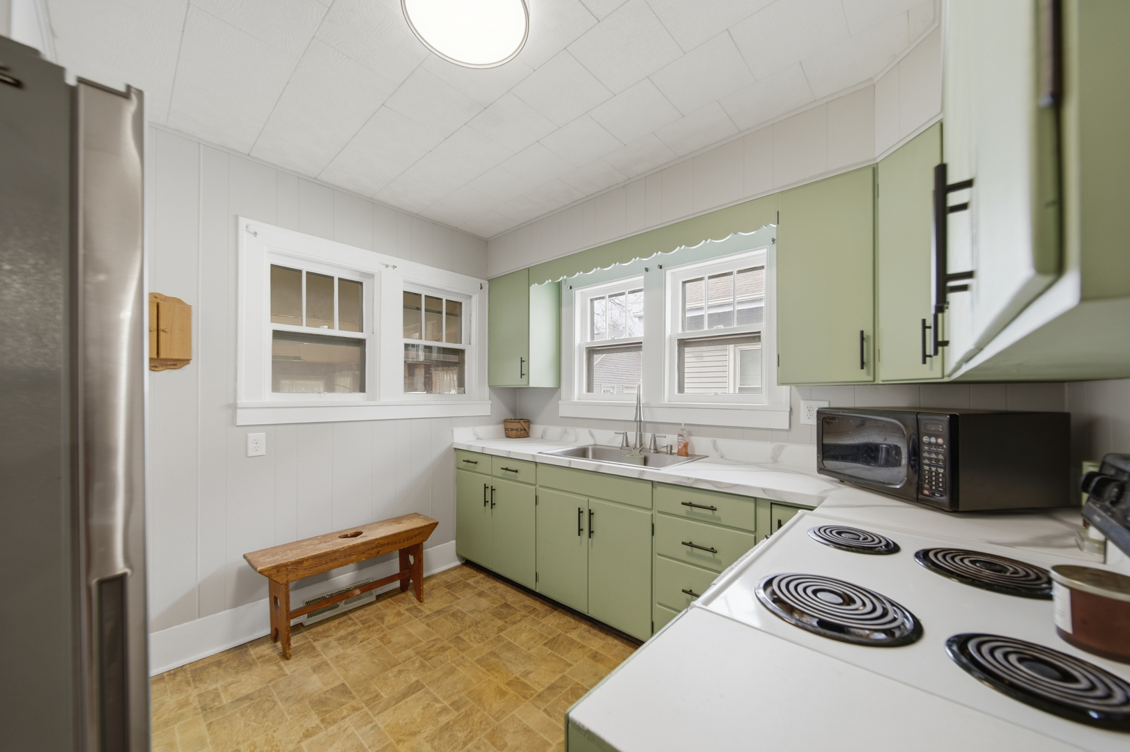 318 Spruce Street Dixon, IL 61021 - Photo 8 of 25 a kitchen with a sink stove and wooden floor