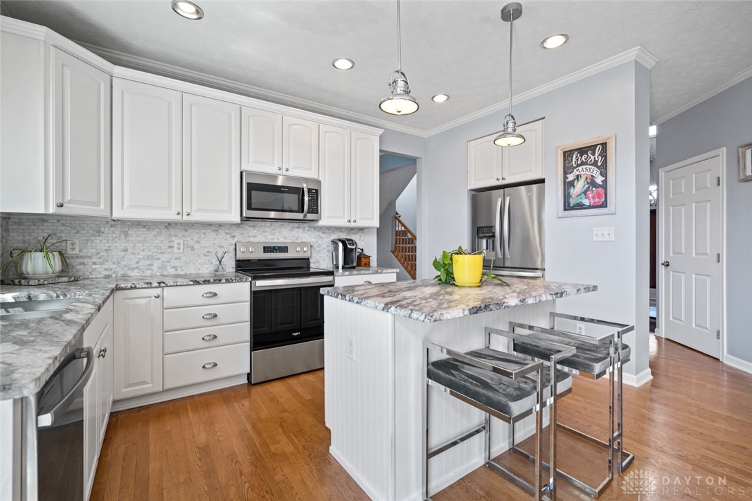 55 Janney Lane Springboro, OH 45066 - Photo 2 of 38 This bright kitchen features wood floors and sleek stainless steel appliances.