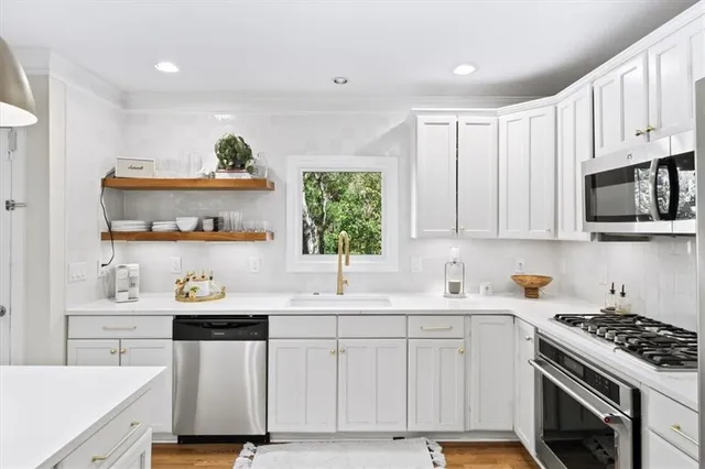 a bedroom with bed and a chandelier