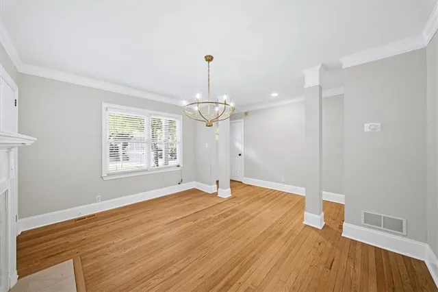 a bedroom with a large bed and a large window