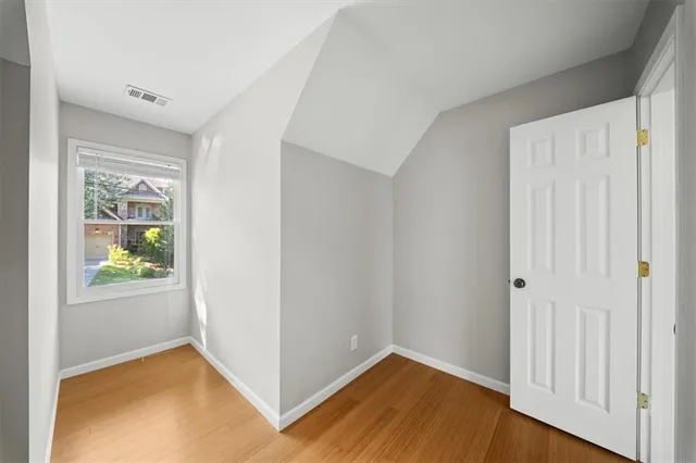 an aerial view of a house with a yard and garden