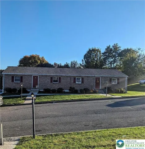 a house view with a backyard space