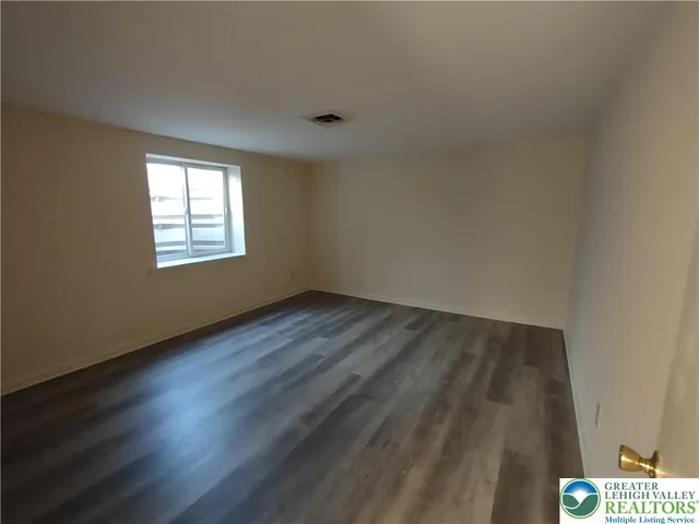 a view of an empty room and window