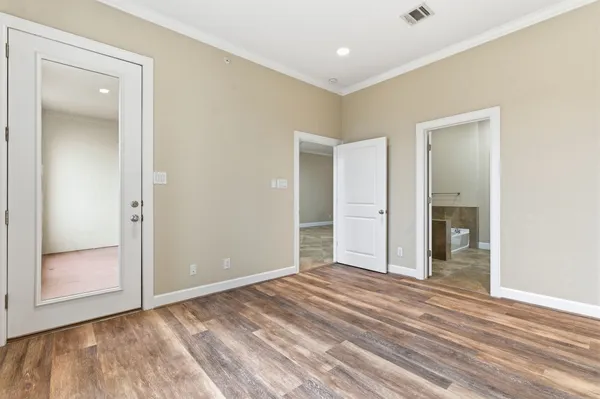 wooden floor and closet area with wooden floor