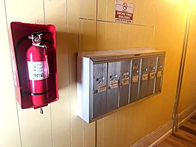 a view of city street with a parked cars