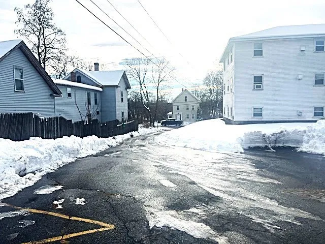 a view of street with parked cars