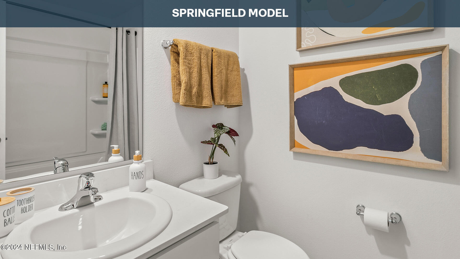 115 Ayamonte Road St. Augustine, FL 32084 - Photo 19 of 37 a bathroom with a toilet sink and mirror