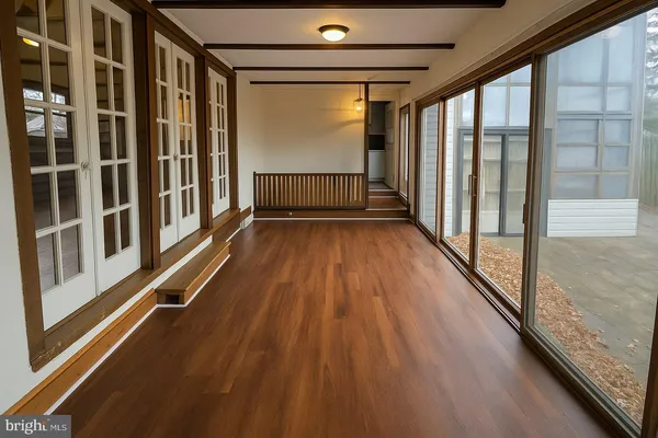 a view of a balcony with wooden floor