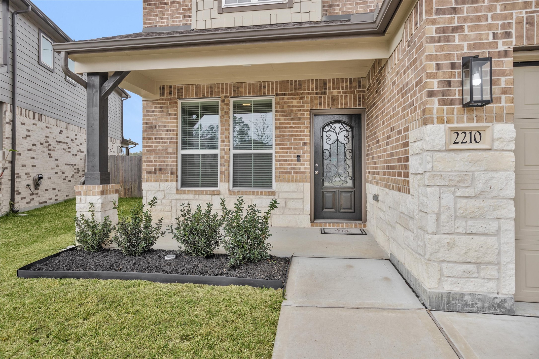 2210 Reed Cave Ln Spring Spring, TX 77386 - Photo 3 of 39 Front porch with stone detail.