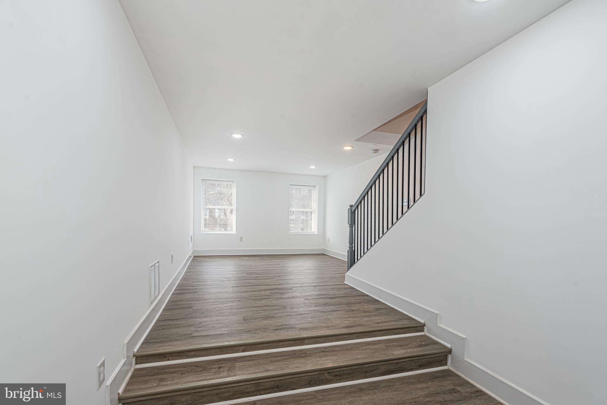1007 North Mount Street Baltimore, MD 21217 - Photo 11 of 22 a view of entryway and hall with wooden floor