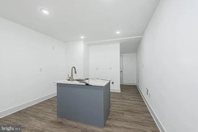 a view of a kitchen from the hallway