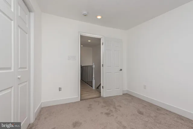 an empty room with closet area