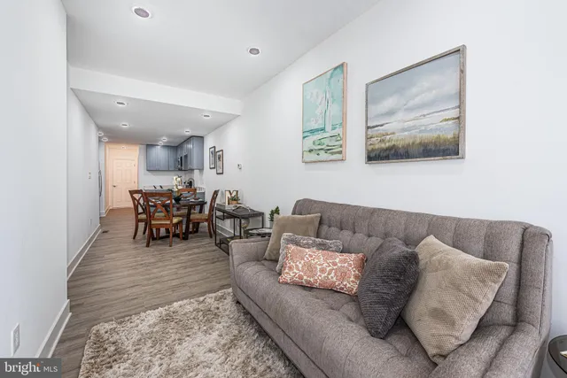 a living room with furniture and a rug