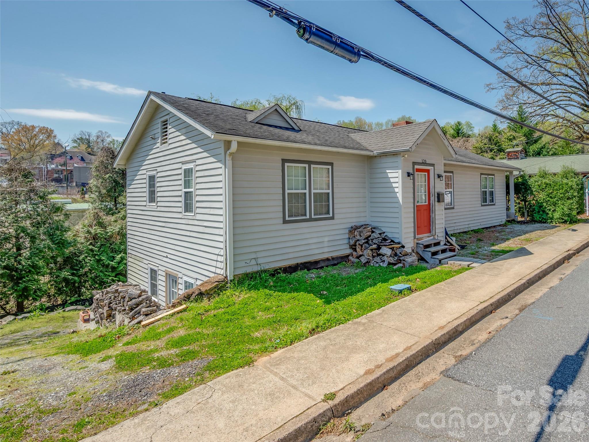 120 East Howard Street Tryon, NC 28782 - Photo 1 of 31 a view of a house with a yard