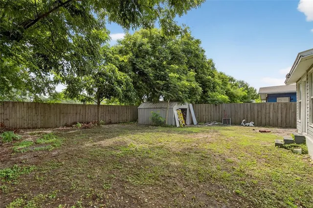 a view of outdoor space with wooden fence