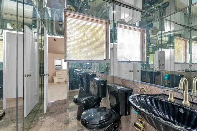 a kitchen with a table chairs and entryway