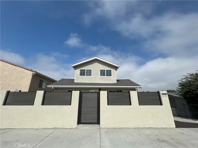 a front view of a house with yard