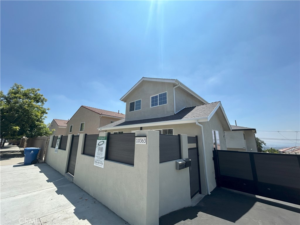 10363 Commerce Avenue Tujunga, CA 91042 - Photo 29 of 31 a front view of a house with a yard