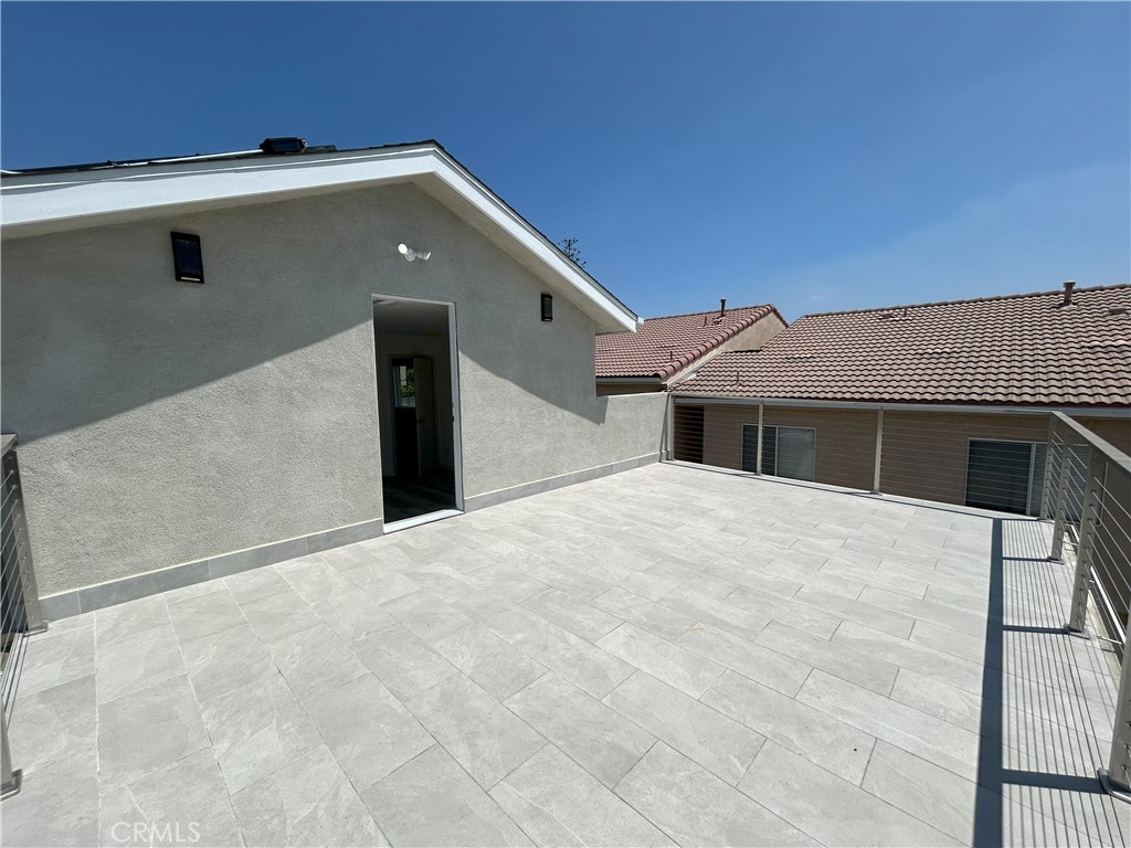 10363 Commerce Avenue Tujunga, CA 91042 - Photo 5 of 31 a front view of a house with a yard
