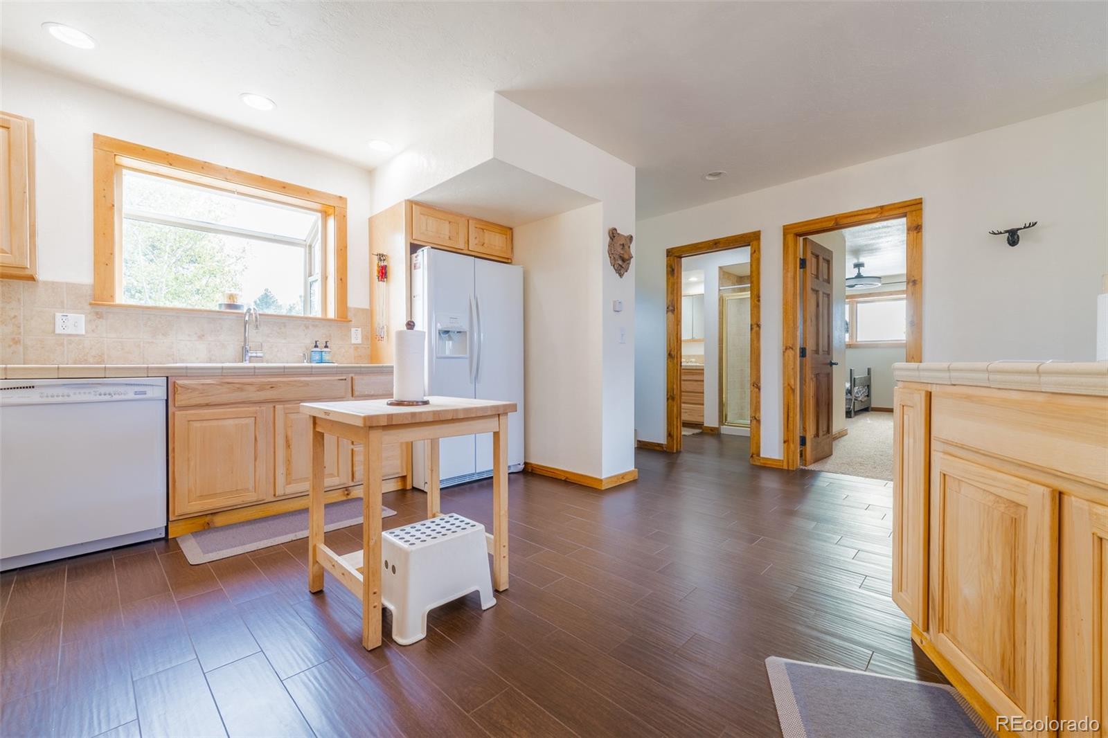 8221 Remington Road Como, CO 80432 - Photo 19 of 49 a view of a kitchen with furniture and wooden floor