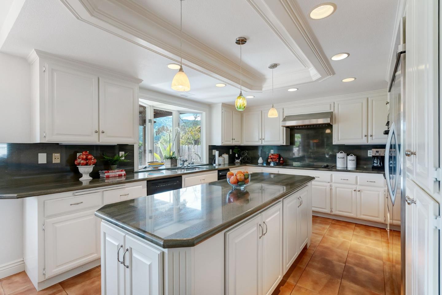 1544 Edmond Drive San Carlos, CA 94070 - Photo 12 of 44 a kitchen with stainless steel appliances granite countertop a sink a stove top oven a counter space and cabinets