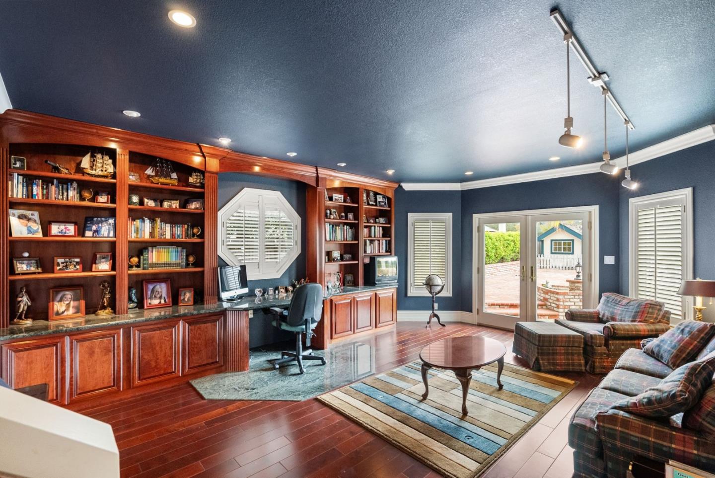 1544 Edmond Drive San Carlos, CA 94070 - Photo 17 of 44 a living room with furniture a window and a bookshelf
