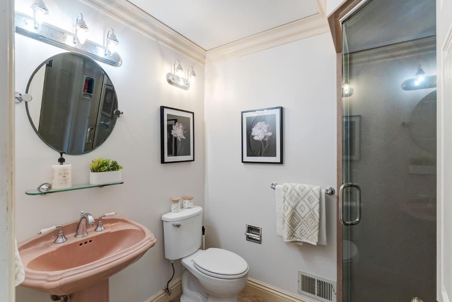 1544 Edmond Drive San Carlos, CA 94070 - Photo 18 of 44 a bathroom with a toilet sink and mirror