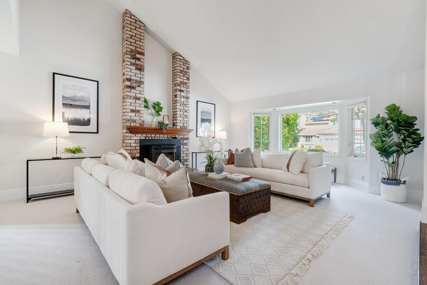 1544 Edmond Drive San Carlos, CA 94070 - Photo 3 of 44 a living room with furniture a fireplace and a potted plant