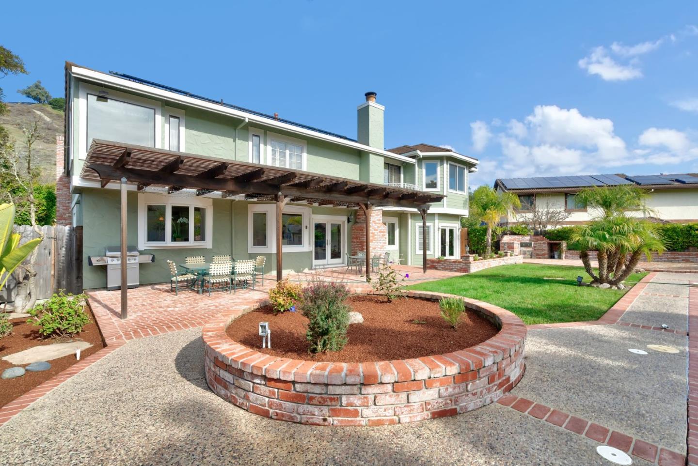 1544 Edmond Drive San Carlos, CA 94070 - Photo 35 of 44 a front view of a house with a yard table and chairs