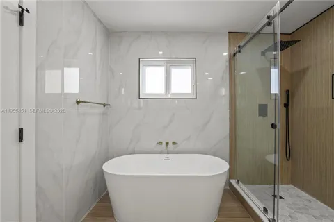 a bathroom with a double vanity sink mirror and