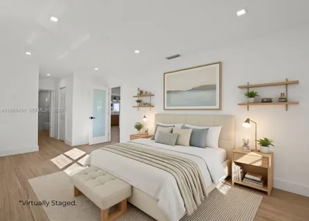 a view of a patio with couches chairs and potted plants
